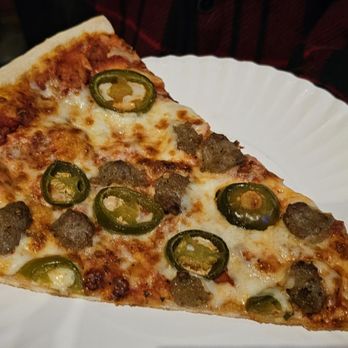 The Onion - a slice of pizza on a paper plate - Pizza Near Me - Austin, Texas The Onion - a slice of pizza on a paper plate - Pizza Near Me - Austin, Texas