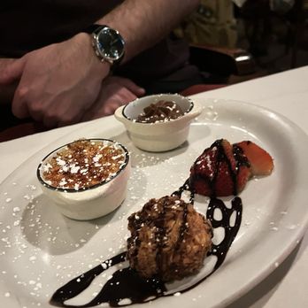 La Voile - Assortment of mini crème brûlée, chocolate mousse, and coconut macaroon. Love that we had the option to try all three! - French Near Me - Boston, Massachusetts
