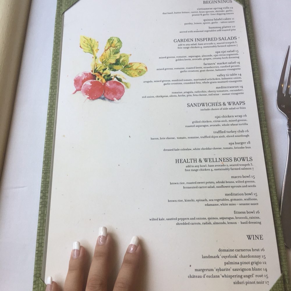 Spa Cafe - a woman's hand on a menu - New American Near Me - Ojai, California Spa Cafe - a woman's hand on a menu - New American Near Me - Ojai, California