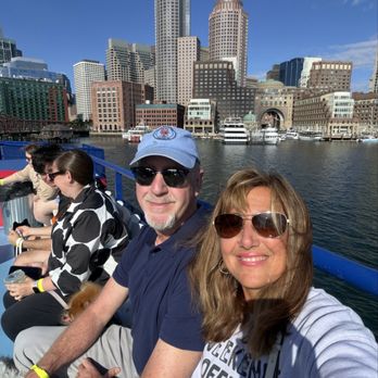 Massachusetts Bay Lines - My husband and I with Boston Seaport behind us - Boating Near Me - Boston, Massachusetts Massachusetts Bay Lines - My husband and I with Boston Seaport behind us - Boating Near Me - Boston, Massachusetts