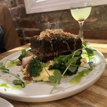 Bunny's Buckets & Bubbles - Side view of the weekly special : beef shank, Osso Bucco on polenta - Chicken Shop Near Me - Baltimore, Maryland