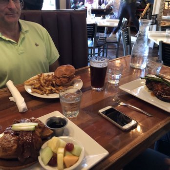 The Place - Chicken and waffles with fruit, buttermilk chicken sandwich with fries, and grilled pork chop. - Southern Near Me - Athens, Georgia The Place - Chicken and waffles with fruit, buttermilk chicken sandwich with fries, and grilled pork chop. - Southern Near Me - Athens, Georgia