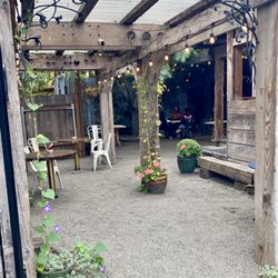 Equiano Coffee - Outdoor seating with roof covering. SO CUTE