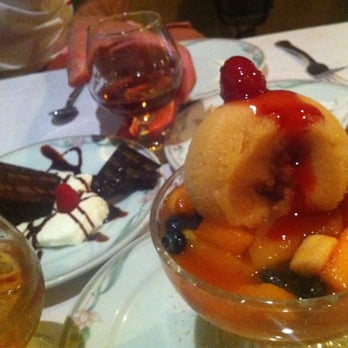 La Piccola Liguria Restaurant - Fruit salad with peach sorbet, chocolate cake, tart, grand marnier and amoretto on the rocks. - Italian Near Me - Port Washington, New York La Piccola Liguria Restaurant - Fruit salad with peach sorbet, chocolate cake, tart, grand marnier and amoretto on the rocks. - Italian Near Me - Port Washington, New York