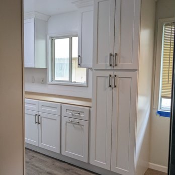 Arrow Design - Tall pantry with a trash can drawer on the left. - Kitchen & Bath Near Me - Sun Valley, California Arrow Design - Tall pantry with a trash can drawer on the left. - Kitchen & Bath Near Me - Sun Valley, California