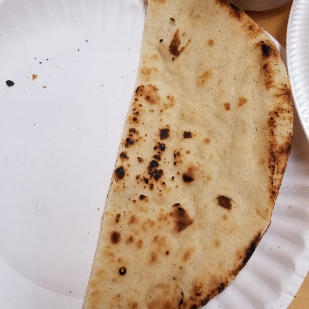 The naan looks and tastes like pita bought in a supermarket. More suitable for falafel.