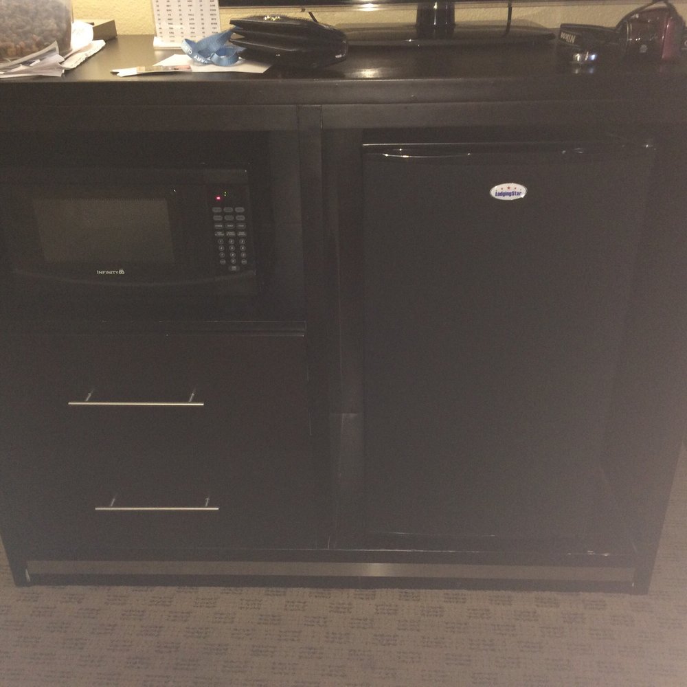 Has a microwave and mini fridge