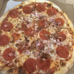 Crust and sauce are solid, ham and uncooked bacon only in the middle. Crust and sauce are solid, ham and uncooked bacon only in the middle.