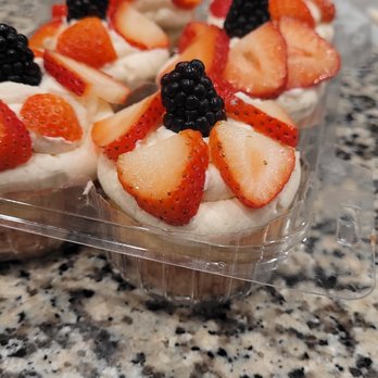 Laynie Ann's Bakery - four cupcakes with strawberries and blackberries - Custom Cakes Near Me
