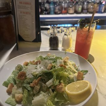 The Exchange - Corpus Christi - Cesar salad with a blueberry mojito mocktail - Bars Near Me - Corpus Christi, Texas The Exchange - Corpus Christi - Cesar salad with a blueberry mojito mocktail - Bars Near Me - Corpus Christi, Texas