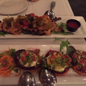 Spain Restaurant - Calamari on top and slices of tomato, mozzarella, cucumber and beets on the bottom. - Spanish Near Me - Cranston, Rhode Island