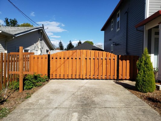 Powered Double Gate - Gorgeous electrically powered double gate with remote operation plus a person gate next to the house with a cobblestone walkway. We set this Powered Double Gate - Gorgeous electrically powered double gate with remote operation plus a person gate next to the house with a cobblestone walkway. We set this