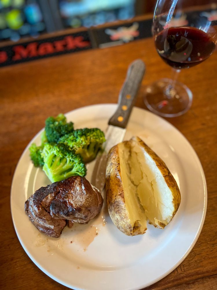 Stacey's Old Faithful Bar & Steakhouse Logo