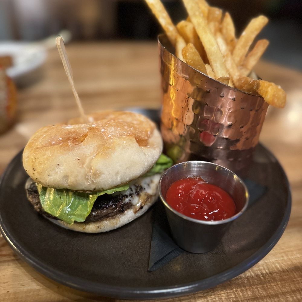 The Stubborn Mule - a burger and fries on a plate - New American Near Me - Orlando, Florida The Stubborn Mule - a burger and fries on a plate - New American Near Me - Orlando, Florida