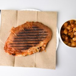 Spreads Bagels and Cafe - Spreads Panini with a side of Hash browns