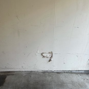 Arbrook Park - Holes in garage - Apartments Near Me - Arlington, Texas