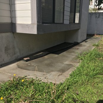 A R Contracting - Before construction, East side, notice the lack of clearance between the concrete sidewalk and stucco. - Waterproofing Near Me A R Contracting - Before construction, East side, notice the lack of clearance between the concrete sidewalk and stucco. - Waterproofing Near Me