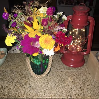 Garden Sweet Farm - a vase of flowers and a lantern - CSA Near Me - Fort Collins, Colorado
