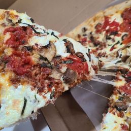 Nice cheese pull on a margherita pizza