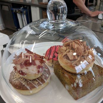 Cafe Dulce - This is half of what they had left at 1:30pm . Got the maple bacon donut, not donut hole. - Coffee & Tea Near Me - Los Angeles, California