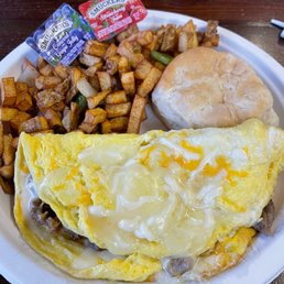 an omelet with a side of potatoes