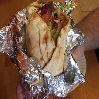 Down East Donairs - a hand holding a pita - Fast Food Near Me - Whitby, Ontario