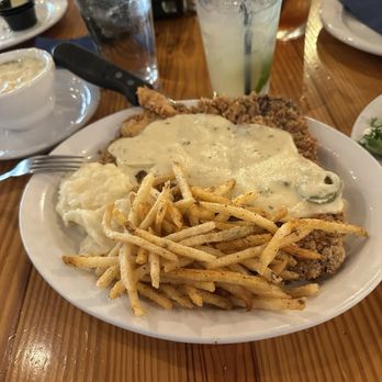 Krause's Cafe - Chicken fried steak with mashed potatoes, french fries and jalapeño gravy. - German Near Me - New Braunfels, Texas Krause's Cafe - Chicken fried steak with mashed potatoes, french fries and jalapeño gravy. - German Near Me - New Braunfels, Texas