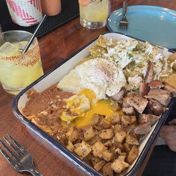 La Nacional - Chilaquiles with delicious carnitas and two perfectly fried eggs - Cocktail Bars Near Me - Chula Vista, California La Nacional - Chilaquiles with delicious carnitas and two perfectly fried eggs - Cocktail Bars Near Me - Chula Vista, California