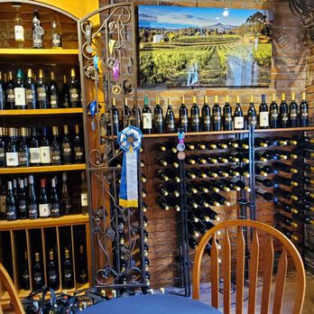 South Stage Cellars - a wine rack with wine bottles - Wine Tasting Room Near Me - Jacksonville, Oregon