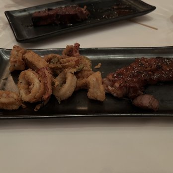 Tellers An American Chophouse - Portions of crispy calamari and black pepper bacon - Steakhouses Near Me - Islip, New York Tellers An American Chophouse - Portions of crispy calamari and black pepper bacon - Steakhouses Near Me - Islip, New York