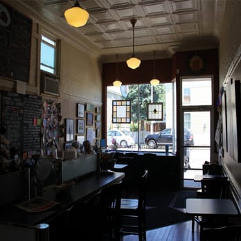 Mud House - Our interior, featuring both table and counter seating. - Coffee & Tea Near Me - Dorchester, Massachusetts