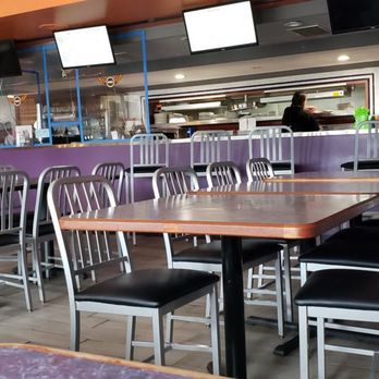 Mai Cafe - tables and chairs in a restaurant - Sports Bars Near Me - Milwaukee, Wisconsin