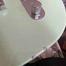 Chips on the guitar I just bought from GuitarCenters website.