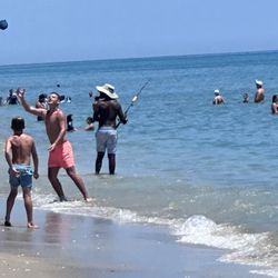 Casting a fully hooked line into the crowd.