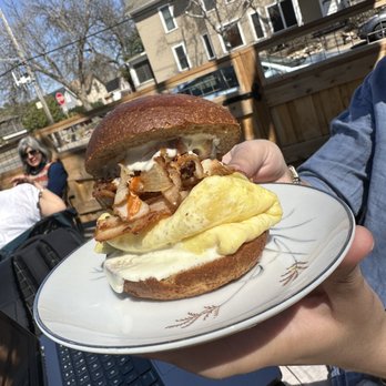 The Briar - a person holding a plate with a sandwich on it - Coffee & Tea Near Me - Minneapolis, Minnesota The Briar - a person holding a plate with a sandwich on it - Coffee & Tea Near Me - Minneapolis, Minnesota