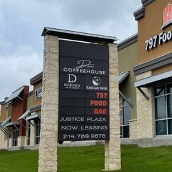 Sigma Sign - Pylon sign with bronze show thru illuminated multi tenant panels at Justice Plaza in Denton, TX