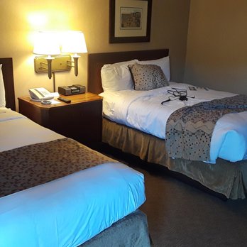 Bahia Resort Hotel - Room with two double beds. Also has ample traditional outlets and USB charging outlets. - San Diego, CA