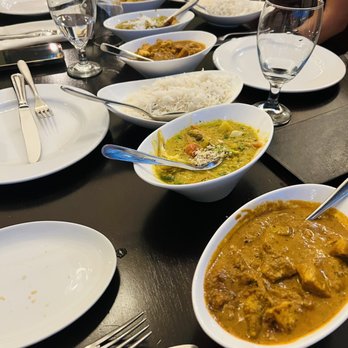 Tulsi - Chicken Tikka, Korma, Curry, Konkani, Vindaloo, Butter Chicken (entrees in order from closest to furthest. + rice and garlic naan of course - Indian Near Me - Richmond, Virginia