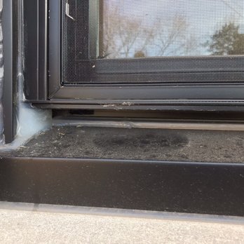 Elysium Restoration Design - Globs and globs of caulk that doesn't match the exterior trim - General Contractors Near Me - St. Peters, Missouri Elysium Restoration Design - Globs and globs of caulk that doesn't match the exterior trim - General Contractors Near Me - St. Peters, Missouri
