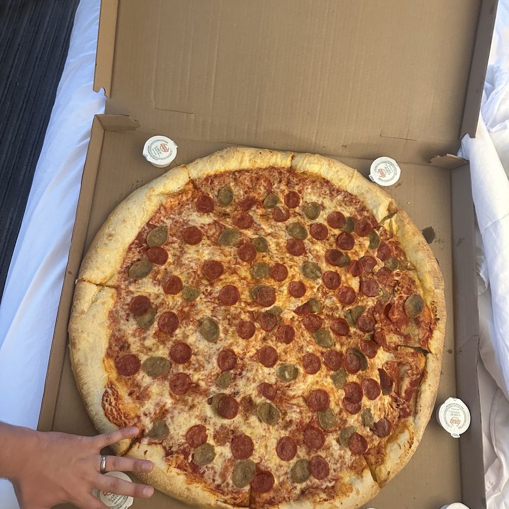 28" Pie Pepperoni and Sausage, hand for a reference