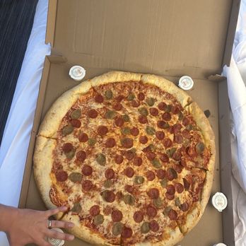 Benny Leone’s - 28" Pie Pepperoni and Sausage, hand for a reference - Pizza Near Me - State College, Pennsylvania