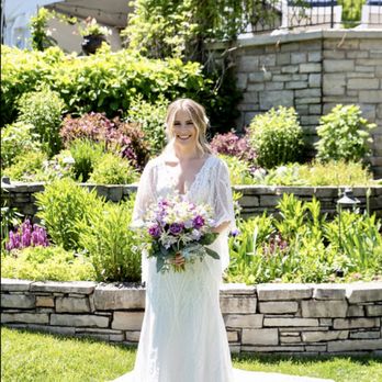 Redpath Gardens - a woman in a wedding dress holding a bouquet - Gardeners Near Me Redpath Gardens - a woman in a wedding dress holding a bouquet - Gardeners Near Me