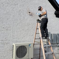 Climate Pro - Our Senior Technician ensuring White Glove Quality to ensure an appealing look for the outside condenser. No, HOA will ever complain!