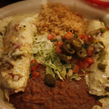 Chuy's - Chicken Enchiladas with oven roasted chicken, fresh spinach and jack cheese, rolled inside homemade corn tortillas, topped with Green Chile - Tex-Mex Near Me - Austin, Texas Chuy's - Chicken Enchiladas with oven roasted chicken, fresh spinach and jack cheese, rolled inside homemade corn tortillas, topped with Green Chile - Tex-Mex Near Me - Austin, Texas