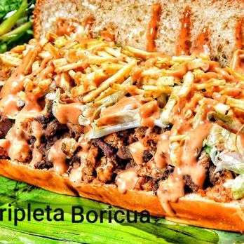 Sabor Latino - a large sandwich with meat and vegetables - Dominican Near Me - Fort Myers, Florida Sabor Latino - a large sandwich with meat and vegetables - Dominican Near Me - Fort Myers, Florida