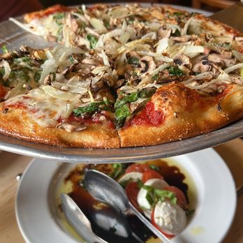 Blue Line Pizza - a pizza on a serving platter - Pizza Near Me - Danville, California Blue Line Pizza - a pizza on a serving platter - Pizza Near Me - Danville, California