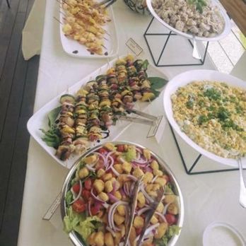 The Yard A Mobile Eatery - a table full of food - Caterers Near Me