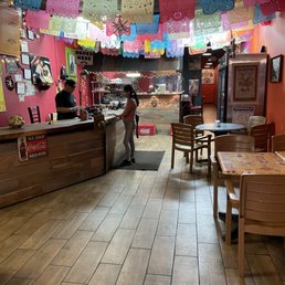 a woman standing at the counter a woman standing at the counter