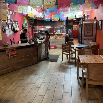 Taqueria Tacos TKO - a woman standing at the counter - Tacos Near Me - Freehold, New Jersey Taqueria Tacos TKO - a woman standing at the counter - Tacos Near Me - Freehold, New Jersey