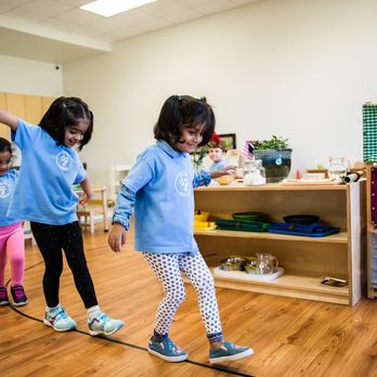 Guidepost Montessori at Flower Mound - Students 'walking the line,' an exercise for improving balance as they navigate the children and carry materials in our classrooms. - Montessori Schools Near Me - Flower Mound, Texas Guidepost Montessori at Flower Mound - Students 'walking the line,' an exercise for improving balance as they navigate the children and carry materials in our classrooms. - Montessori Schools Near Me - Flower Mound, Texas